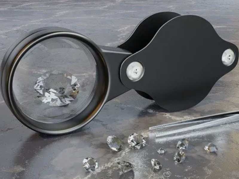 A magnifying glass with diamonds in it.