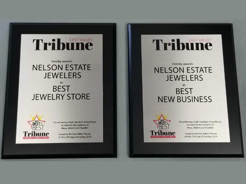 Two framed plaques with the word tribune on them.