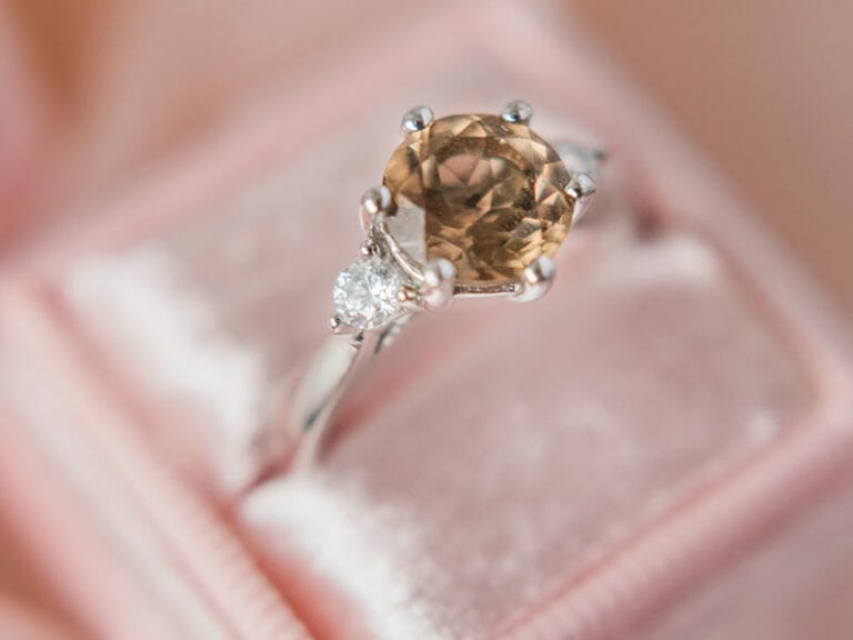 An engagement ring with a smoky quartz and diamonds.