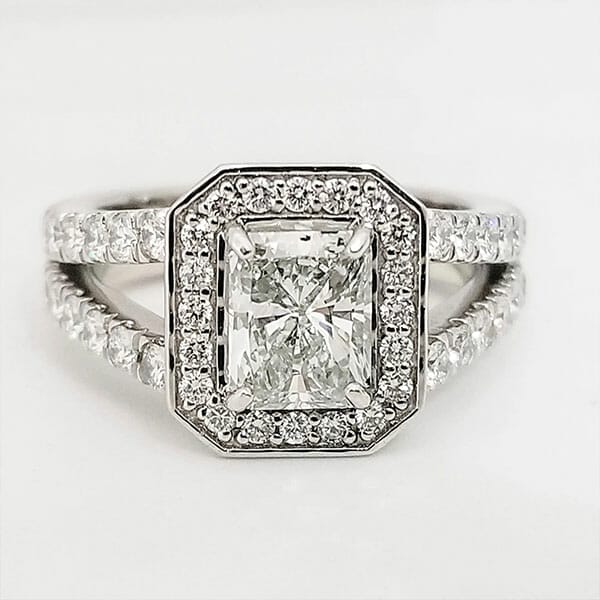 A princess cut diamond halo engagement ring.