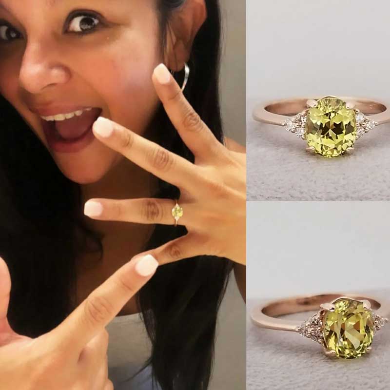 A woman with a yellow sapphire engagement ring.