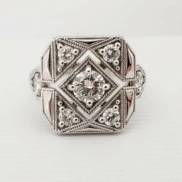 A white gold ring with diamonds in the center.