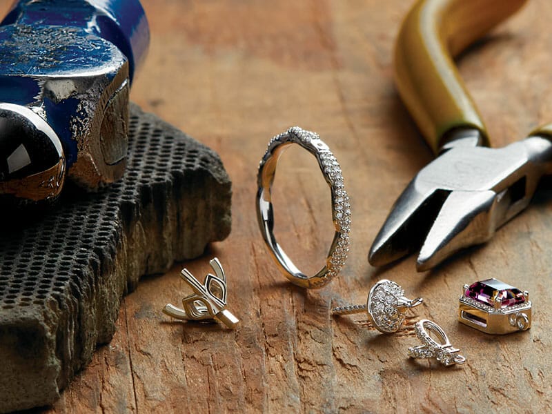 A group of jewelry tools on a table.